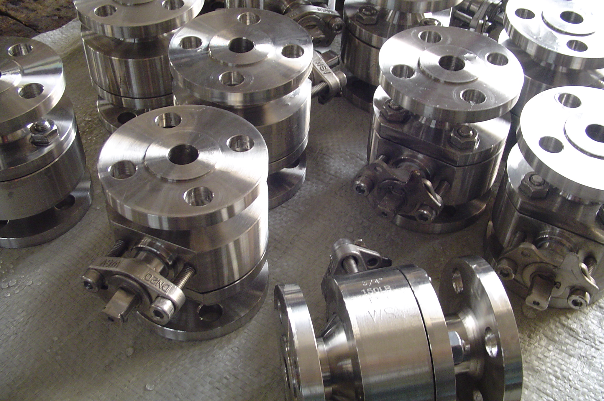 Rows of machined duplex ball valves with flanged connections